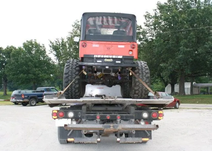 A jeep loaded onto a flatbed truck as part of Vehicle Recovery Services in Effingham IL