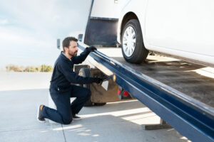 A car is put on a tow trucks from Heartland Towing and Recovery, which offers Tow Trucks Mattoon IL drivers trust