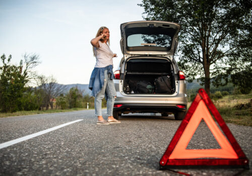 A woman with a broken down car calls Heartland Towing & Recovery, tow trucks Mattoon drivers trust