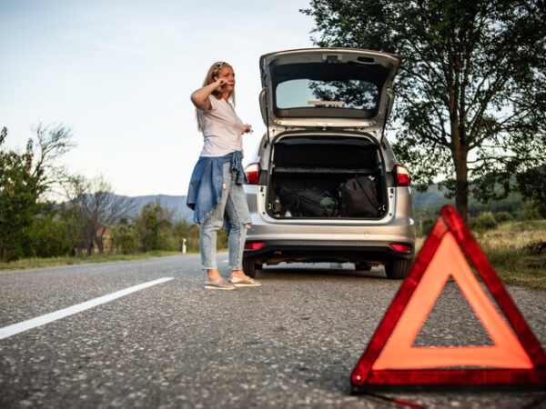 A woman with a broken down car calls Heartland Towing & Recovery, tow trucks Mattoon drivers trust