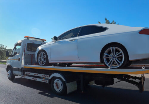 A car is towed as part of services for Tow Trucks Effingham IL