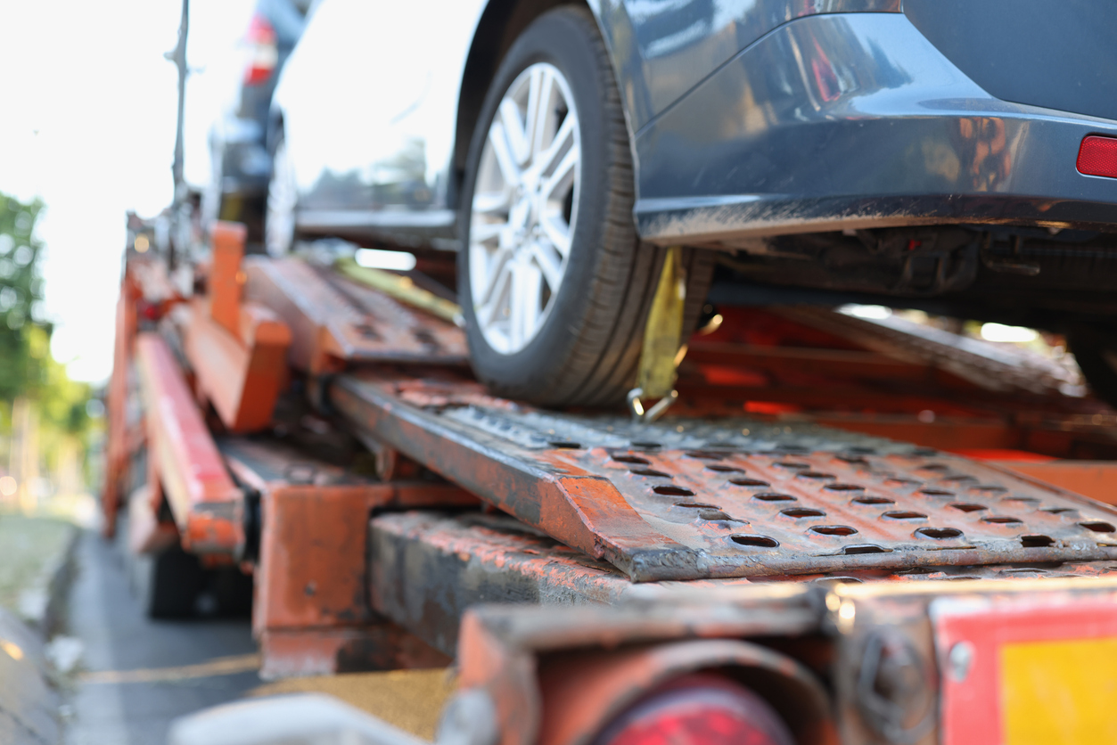 A car is on a truck after the driver called for towing Vandalia IL services