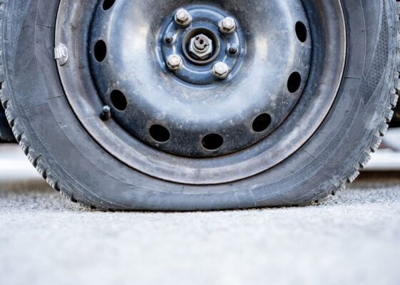 A car with a flat tire needs towing Farina IL services