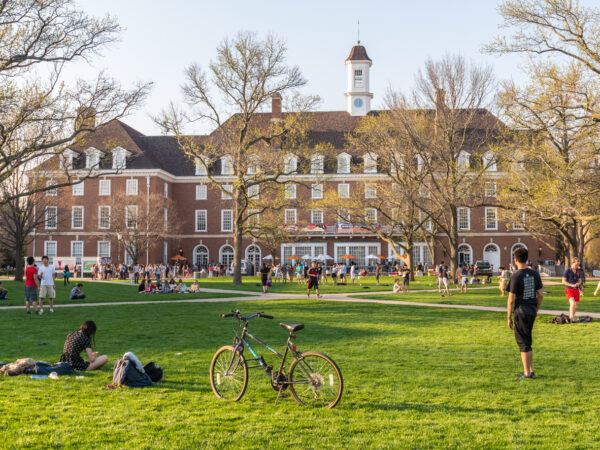 Students are out on the Quad lawn of the University of Illinois college campus in Urbana Champaign IL