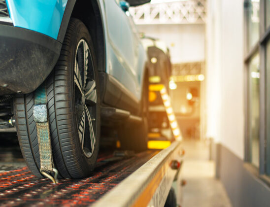 Loading broken car on a tow truck on a roadside in Charleston IL